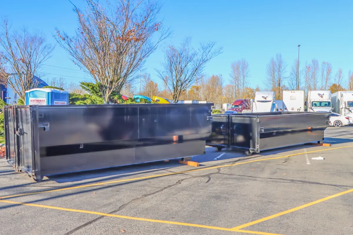 Professional dumpster rental service with roll-off container on residential driveway in Sun City Center